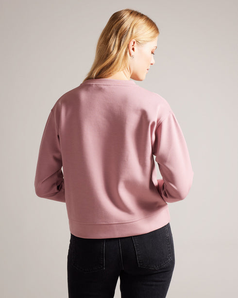 LIVANAA-Tops-Who says you can't be comfortable and chic? With a crew neck, long sleeves and embossed logo detail, LIVANAA is the staple sweatshirt that your wardrobe has been craving. Sweatshirt Embossed Ted Baker logo Crew neck Long sleeves Ayo is 5'8" / 1.73m and wears Red in a Ted size 1- Ted Baker Romania